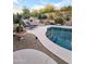 Relaxing backyard oasis with a sparkling pool, patio, and desert landscaping at 9600 E Balancing Rock Rd, Scottsdale, AZ 85262