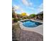 Freeform pool with brick pavers and surrounding desert landscaping at 9600 E Balancing Rock Rd, Scottsdale, AZ 85262