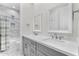 Elegant bathroom with double vanity, marble tile, and a soaking tub at 9630 E Mountain Spring Rd, Scottsdale, AZ 85255