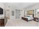 Primary bedroom with sliding barn door and sitting area at 9630 E Mountain Spring Rd, Scottsdale, AZ 85255