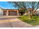 House exterior with a three-car garage and manicured lawn at 9630 E Mountain Spring Rd, Scottsdale, AZ 85255