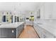 Modern kitchen featuring white cabinets, quartz countertops, and an island at 9630 E Mountain Spring Rd, Scottsdale, AZ 85255