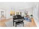 Bright living room with hardwood floors, grand piano and large windows at 9630 E Mountain Spring Rd, Scottsdale, AZ 85255