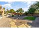 Landscaped backyard with a pool, spa, and artificial turf at 1007 W Armstrong Way, Chandler, AZ 85286