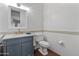 Modern bathroom with gray vanity and white tile at 1007 W Armstrong Way, Chandler, AZ 85286