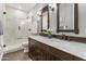 Elegant bathroom with double vanity and marble shower at 1007 W Armstrong Way, Chandler, AZ 85286