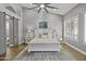 Bright bedroom with high ceilings, barn doors, and a white platform bed at 1007 W Armstrong Way, Chandler, AZ 85286