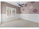 Charming bedroom with unique wall stenciling and ceiling fan at 1007 W Armstrong Way, Chandler, AZ 85286