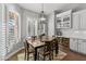 Bright dining room features a wood table, chandelier, and built-in cabinetry at 1007 W Armstrong Way, Chandler, AZ 85286