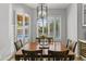 Sunlit dining area with wood table and elegant chandelier at 1007 W Armstrong Way, Chandler, AZ 85286