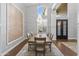 Formal dining room with chandelier, wall decor, and hardwood floors at 1007 W Armstrong Way, Chandler, AZ 85286