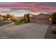 Two-story home with a three-car garage and nicely landscaped front yard at 1007 W Armstrong Way, Chandler, AZ 85286