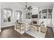 Open living room with a stone fireplace and custom built-ins at 1007 W Armstrong Way, Chandler, AZ 85286