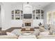 Living area showcasing a fireplace and an abundance of built-in shelving at 1007 W Armstrong Way, Chandler, AZ 85286