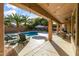 Spacious covered patio with comfortable seating and string lights at 1007 W Armstrong Way, Chandler, AZ 85286