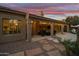 Expansive covered patio with string lights, creating a relaxing ambiance at 1007 W Armstrong Way, Chandler, AZ 85286