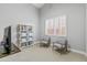 Spacious playroom with two armchairs and a large window at 1007 W Armstrong Way, Chandler, AZ 85286