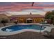 Stunning pool and spa at sunset, with outdoor lighting and seating at 1007 W Armstrong Way, Chandler, AZ 85286