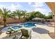 Inviting backyard oasis with a sparkling pool, lounge chairs, and lush landscaping at 1007 W Armstrong Way, Chandler, AZ 85286