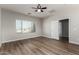 Well-lit bedroom with large window and ceiling fan at 10116 W Luxton Ln, Tolleson, AZ 85353