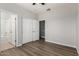 Bedroom with double doors leading to bathroom and hallway at 10116 W Luxton Ln, Tolleson, AZ 85353