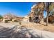 Two-story house with Spanish-style architecture, featuring a large garage and landscaped front yard at 10116 W Luxton Ln, Tolleson, AZ 85353