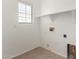 Laundry room with overhead shelving and window at 10116 W Luxton Ln, Tolleson, AZ 85353