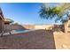 Private backyard with sparkling pool and gravel at 10116 W Luxton Ln, Tolleson, AZ 85353