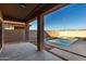 Covered patio overlooking a refreshing blue pool at 10116 W Luxton Ln, Tolleson, AZ 85353