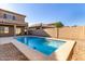 Inviting blue swimming pool in the backyard at 10116 W Luxton Ln, Tolleson, AZ 85353