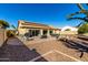 Backyard view showing patio, landscaping, and shed at 10329 E Sunridge Dr, Sun Lakes, AZ 85248