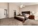 Main bedroom with a plush bed and ensuite bathroom access at 10329 E Sunridge Dr, Sun Lakes, AZ 85248