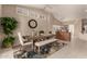 Bright dining room features a large table, bench seating, and decorative accents at 10329 E Sunridge Dr, Sun Lakes, AZ 85248