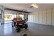 Attached garage with golf cart and storage cabinets at 10329 E Sunridge Dr, Sun Lakes, AZ 85248