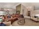 Spacious living room featuring a curved leather sofa and a neutral color palette at 10329 E Sunridge Dr, Sun Lakes, AZ 85248