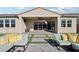 Covered patio and seating area in a landscaped backyard at 10709 E Thornton Ave, Mesa, AZ 85212