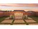 Landscaped backyard with fire pit and string lights at 10709 E Thornton Ave, Mesa, AZ 85212