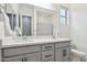 Modern bathroom with double vanity and gray cabinets at 10709 E Thornton Ave, Mesa, AZ 85212