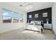 Bright bedroom with white furniture, accent wall and chandelier at 10709 E Thornton Ave, Mesa, AZ 85212