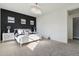 Bright bedroom with white furniture, accent wall, and chandelier at 10709 E Thornton Ave, Mesa, AZ 85212