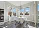 Bright breakfast nook with white table and chairs at 10709 E Thornton Ave, Mesa, AZ 85212