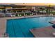 Resort-style pool with a clubhouse and shaded seating areas at 10709 E Thornton Ave, Mesa, AZ 85212