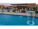 Resort-style pool with water feature and lounge chairs at 10709 E Thornton Ave, Mesa, AZ 85212