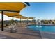 Relax by the pool under shade structures; a fun water feature adds to the appeal at 10709 E Thornton Ave, Mesa, AZ 85212