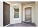 Double-door entry with brick flooring and natural light at 10709 E Thornton Ave, Mesa, AZ 85212