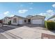 Stunning two-car garage and manicured landscaping at 10709 E Thornton Ave, Mesa, AZ 85212