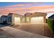 Two-story home with a two-car garage and brick driveway at 10709 E Thornton Ave, Mesa, AZ 85212