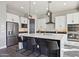 Modern kitchen with white shaker cabinets and stainless steel appliances at 10709 E Thornton Ave, Mesa, AZ 85212