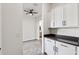 Bright laundry room with built-in cabinets and countertop at 10709 E Thornton Ave, Mesa, AZ 85212