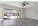 Living room with sliding doors to backyard and neutral colors at 10709 E Thornton Ave, Mesa, AZ 85212